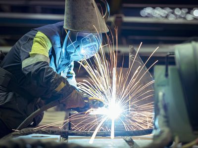 Female welder in steelworks