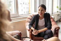 young female adult talking with her co-worker