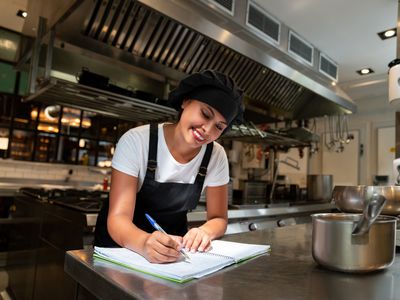 Happy chef working at a restaurant