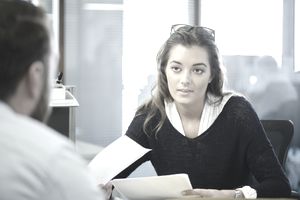 Young HR female staffer accepts an employee resignation.