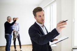 Real estate appraiser examines a home
