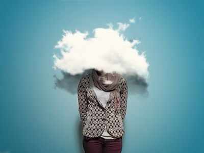 a photo illustration of a woman with her head in the clouds