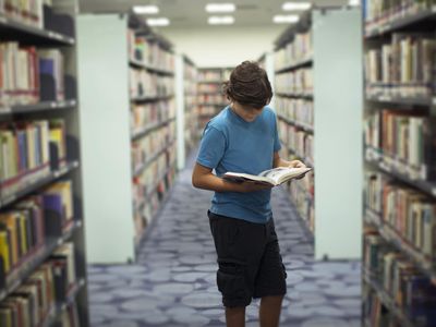 A boy reading a book written in 3rd person limited POV