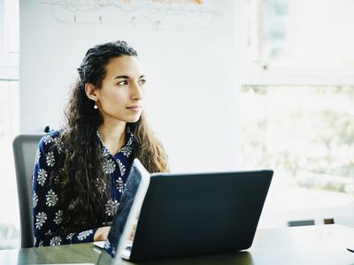 Businesswoman working on laptop in office