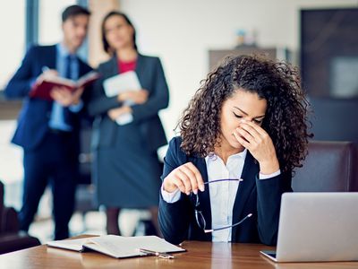 Burnout businesswoman under pressure in the office
