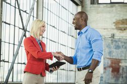 Salesperson shaking hands with potential customer