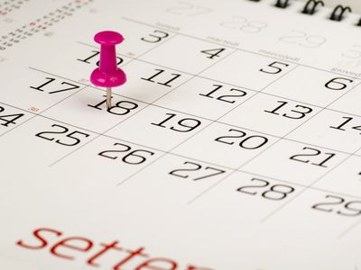 A pin on a date in a calendar