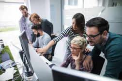 Software developers solving a problem - stock photo