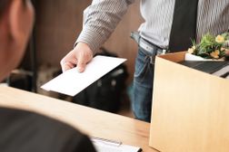 Employee Giving Resignation To Employer In Office