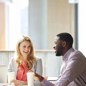 employees take coffee break together in a culturally diverse workplace