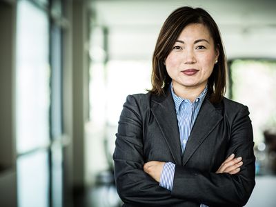 Chief Executive Officer (CEO) with arms crossed
