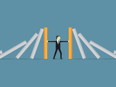 illustration of businessman holding up falling walls around him