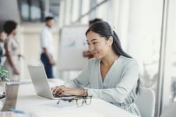 Woman typing on laptop