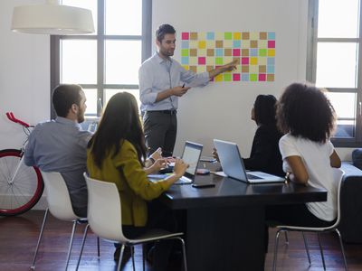 Businessman leading a presentation in office