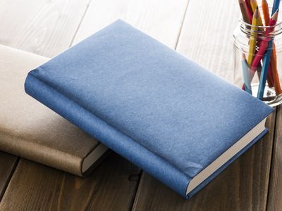 Books with office supplies.