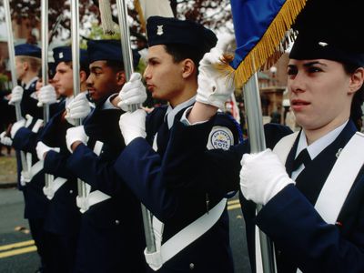 Junior ROTC members carrying flags