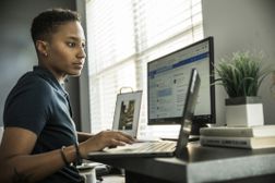 young woman working on desktop computer