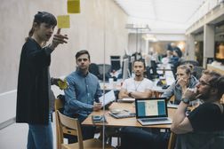 Project Manager in a planning meeting