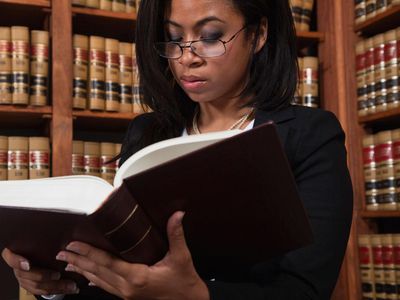 Woman reading in law library