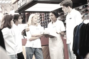 Retail sales manager holding meeting with employees