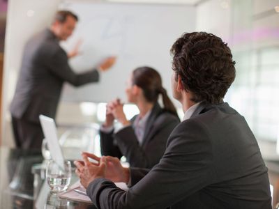 Businessman talking to co-workers in conference room