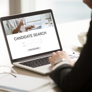 Businessman using online resume search, choosing cv, human resou