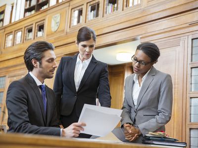 Lawyers Examining Documents in Court