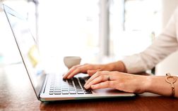 Woman typing on laptop
