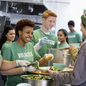 volunteers helping with kitchen service