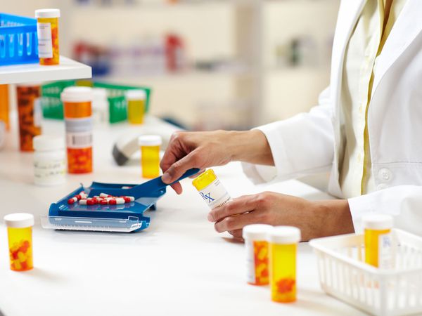 Pharmacist Filling Prescription of Pills