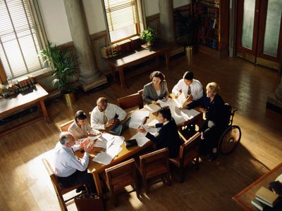 Lawyers meeting in conference room, elevated view