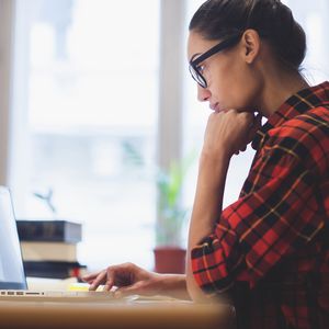 Woman taking an online talent assessment for employment.
