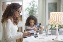 Woman working from home with child remote work