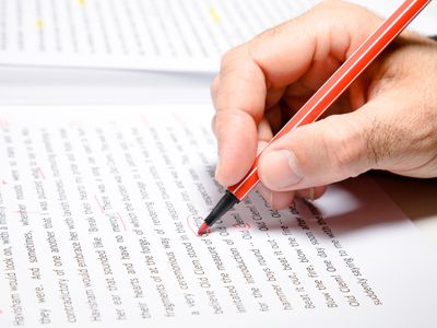 Man editing a manuscript as part of the publishing process.
