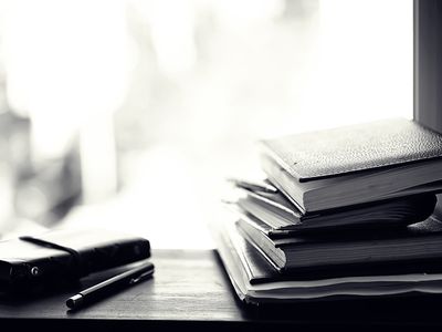 A stack of textbooks on a table