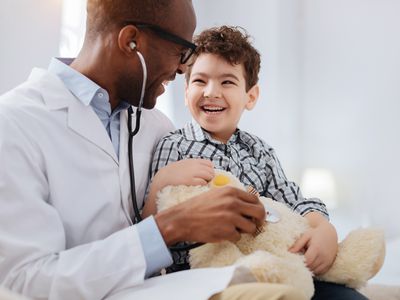 Pediatrician with child