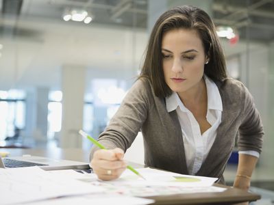 businesswoman working at open space desk