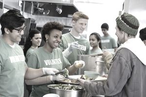volunteers helping with kitchen service