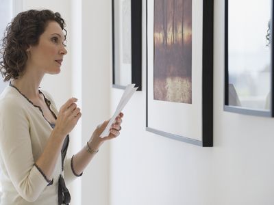 Woman looking at art in an art gallery.